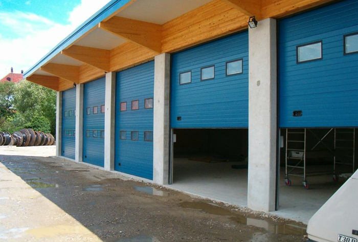Pose de portes sectionnelles pour bâtiments industriels, quais de déchargement, locaux industriels et entrepôts  - La Fermeture Parisienne - Val-d-oise